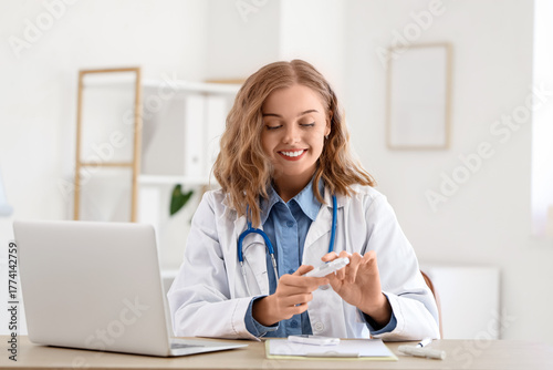 Female doctor with lancet p...