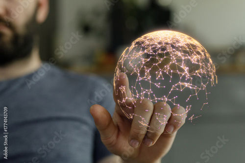 Image of a man holding a gl...