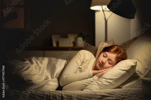 Cute girl sleeping with lig...