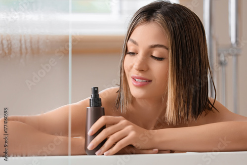 Pretty young woman with bot...