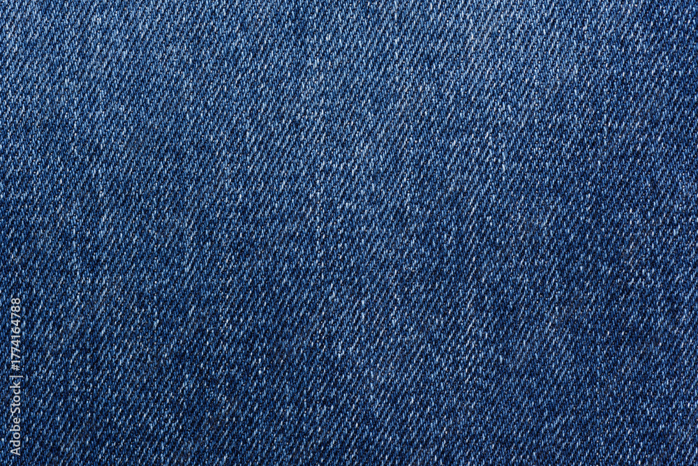 Naklejka premium Washed denim fabric texture background