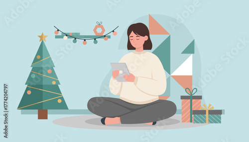 Cozy woman using tablet near Christmas tree and gifts Holiday shopping communication or leisure time