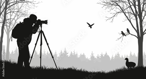 Silhouette of a photographer with a camera on a tripod capturing wildlife.