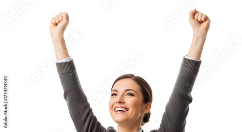 A smiling woman with her arms raised in the air, wearing a gray sweater, against a white background.
