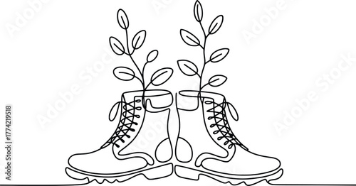 Single line drawing of boots with growing plants represents sustainable fashion and eco-friendly style