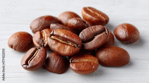 Close up of Rich Brown Roasted Coffee Beans Scattered on a White Wooden Surface with Natural Lighting and Shallow Depth of Field