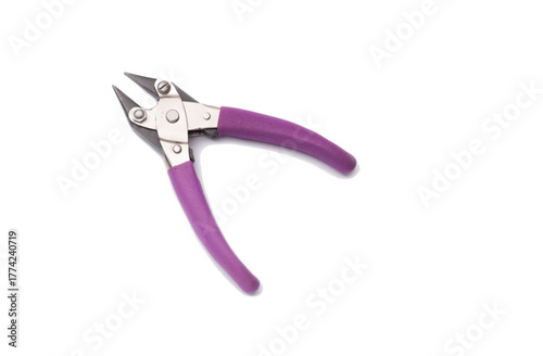Purple handled pliers on a white background.