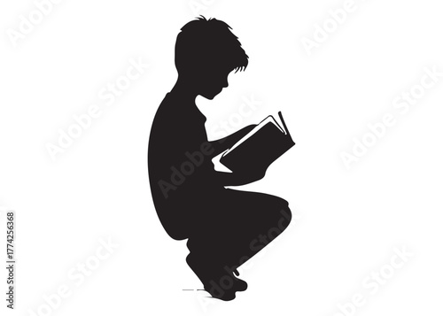 Silhouette of a boy reading a book while squatting