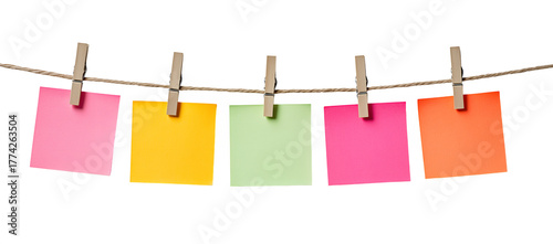 Colorful blank sticky notes hanging on a clothesline with clothespins