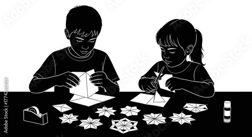 Two young children, a boy and a girl, are diligently engaged in a creative winter craft activity, carefully folding and cutting paper snowflakes.