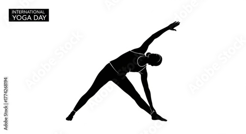 Silhouette of a woman practicing yoga in triangle pose for international yoga day healthy lifestyle and exercise concept for wellness