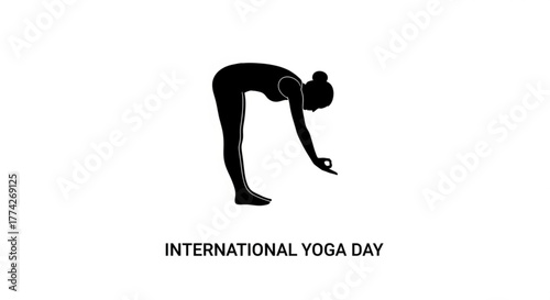 Silhouette of a woman in a standing forward bend yoga pose, commemorating international yoga day