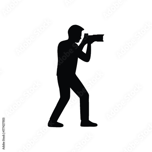 Silhouette of a photographer holding a camera and taking a picture against a white background. photography camera icon.