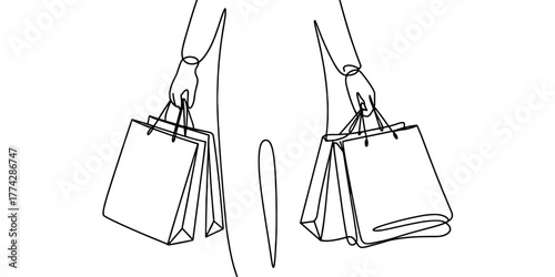 a person holding shopping bags in both hands, symbolizing retail, fashion, and consumer lifestyle.