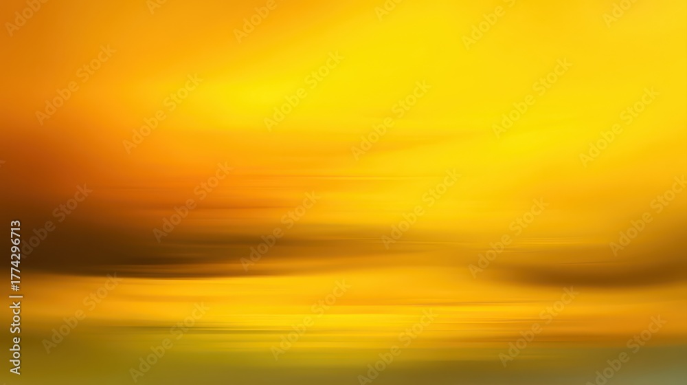 Obraz premium An abstract, blurred landscape of vibrant yellow and orange hues with horizontal streaks, evoking warmth, light, and motion. A serene yet dynamic golden background, blurred yellow background