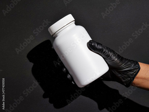 Hand Holding Medicine Bottle Mockup – White Pharmaceutical Container with Black Glove, Blank Label Design for Branding, Healthcare, and Medical Product Promotion