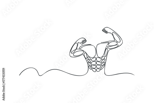 Muscular man flexing arms with defined abs