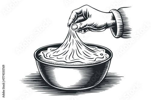 Hand pulling stretchy dough from bowl