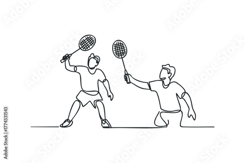 Two people playing badminton with rackets