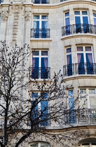 Haussmannian building facade showing ornate balconies and traditional European residential apartment architecture in a city. Antwerp, Belgium