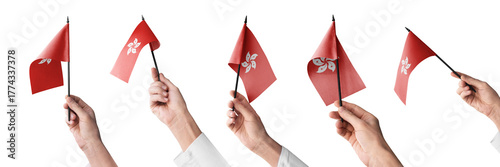 The Hong Kong flag in hand in different angles on a white background