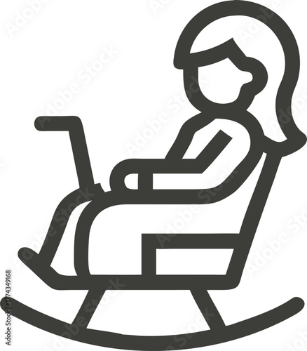Woman working on laptop in rocking chair silhouette