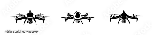 Three drones in a row, front view, black and white.