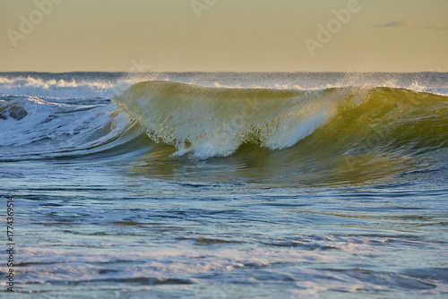 Morning tones filter through the waves as they build intensity.