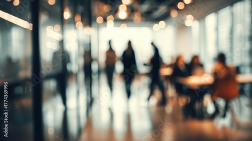 Wallpaper Mural Soft focus view of a modern office space filled with people engaged in work and conversations Torontodigital.ca