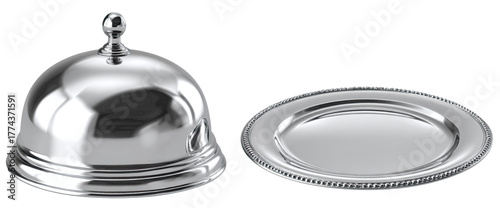 A shiny serving cloche and serving platter sit on a white surface, reflecting the light