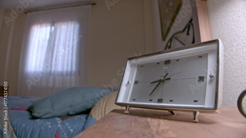 time lapse. Vintage Bedside Clock on Nightstand in Cozy Bedroom Setting