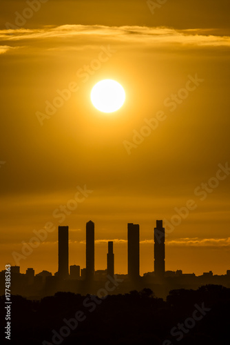 Sunrise views of the Madrid skyline through the morning mist