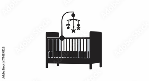Modern black crib with a playful mobile, ready for a new baby