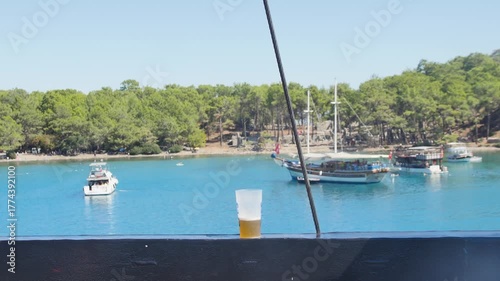 Vacation ambiance video, capturing the feeling of enjoying a refreshing drink while sailing on a boat trip.