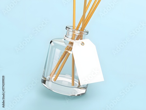 Reed diffuser with tag on a light blue background for home fragrance and aromatherapy use