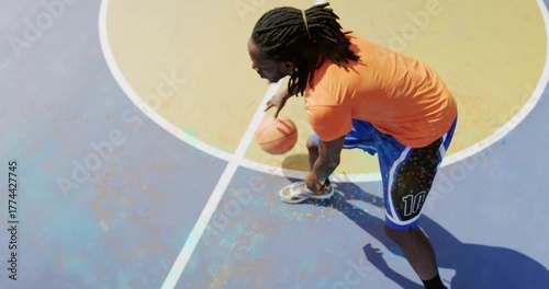 Basketball player dribbling after foot plant on painted halfcourt, overlaying dynamic sports stats