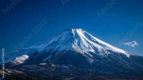 Majestic Mount Fuji towering over a peaceful Japanese town in winter