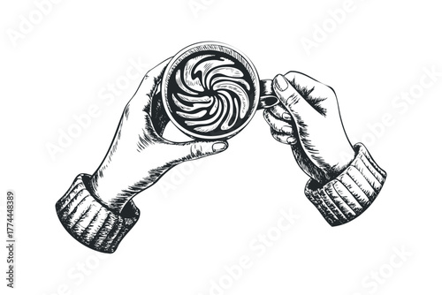 Hand holding warm beverage with latte art