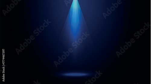 dark stage background illuminated by a blue spotlight beam from above. Perfect for product presentation, concert poster, advertising, or dramatic lighting concept. Ideal for digital banners, templates