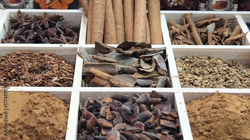 Exploring the vibrant world of herbs and spices in a local market filled with diverse aromas and colorful ingredients