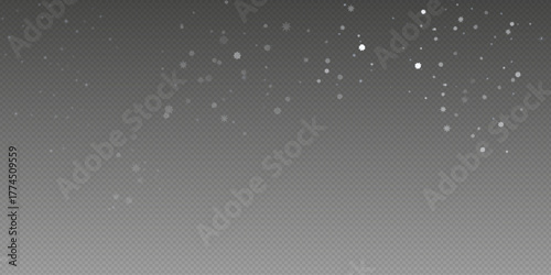 Christmas glittering snowflakes in air on transparent background. Snow overlay effects. Snow background. Heavy snowfall with frosty particles. Winter ambiance.