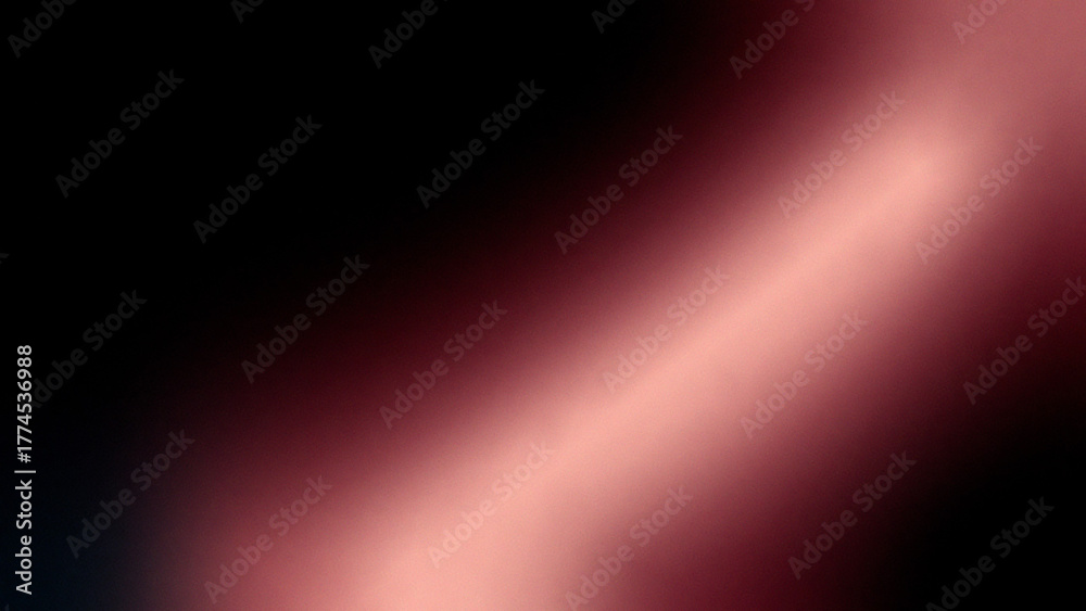 Obraz premium A blurred image showing a gradient of dark black to light pink with a diagonal light beam effect color gradient transition