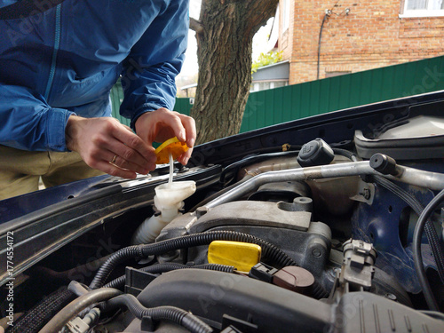 Learning to check car fluids in the driveway