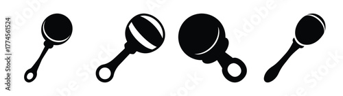 Four simple black baby rattles displayed on a