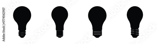 Four black light bulbs silhouettes variety of shapes and designs simple icons