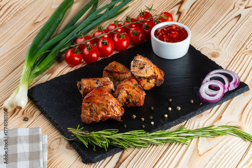 Grilled pork shashlik on a wooden table