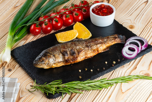 Grilled trout shashlik on a wooden table
