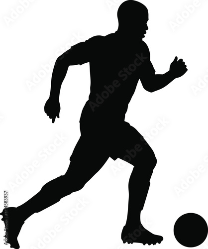 Silhouette of a soccer player dribbling a ball