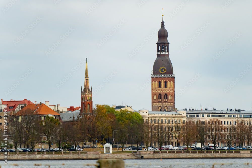 Fototapeta premium Scenic cityscape of Riga with cathedral spires, waterfront, and historical architecture representing Baltic charm, tourism attraction, and cultural identity of the capital’s old town district