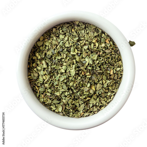 Dried chopped basil in white ceramic bowl Isolated transparent on white background